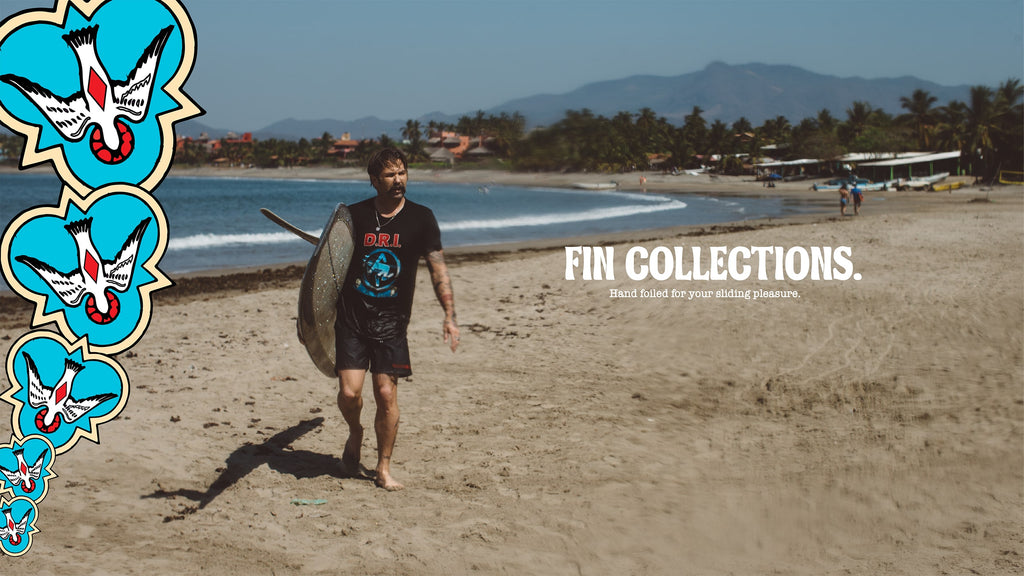 CJ Nelson walking down the beach. Fin Collections. Hand foiled for your sliding pleasure.