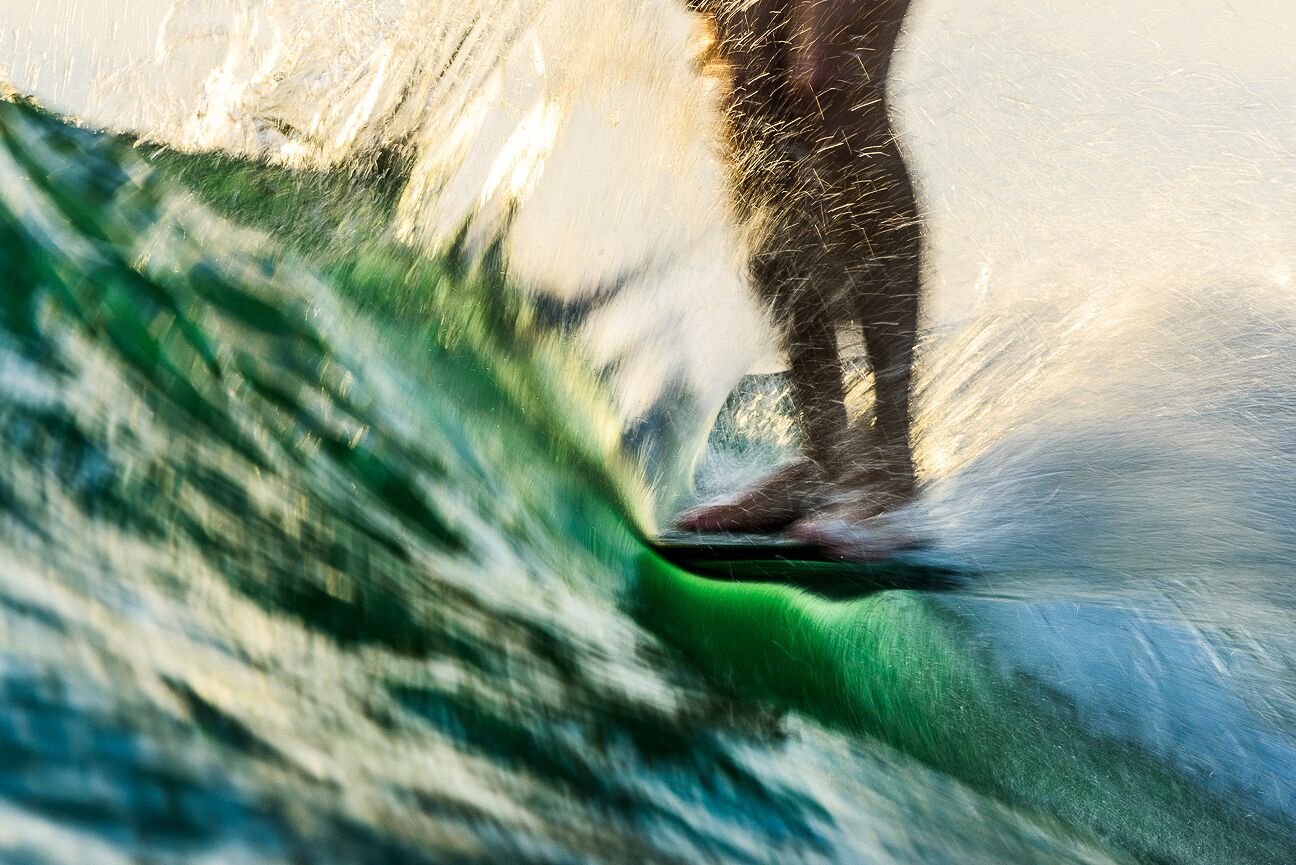 In the water close up of Josh's feet hanging 10.