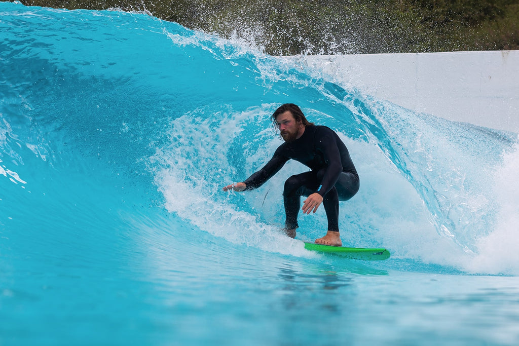 Ben Skinner inside small barrel at a wave pool.